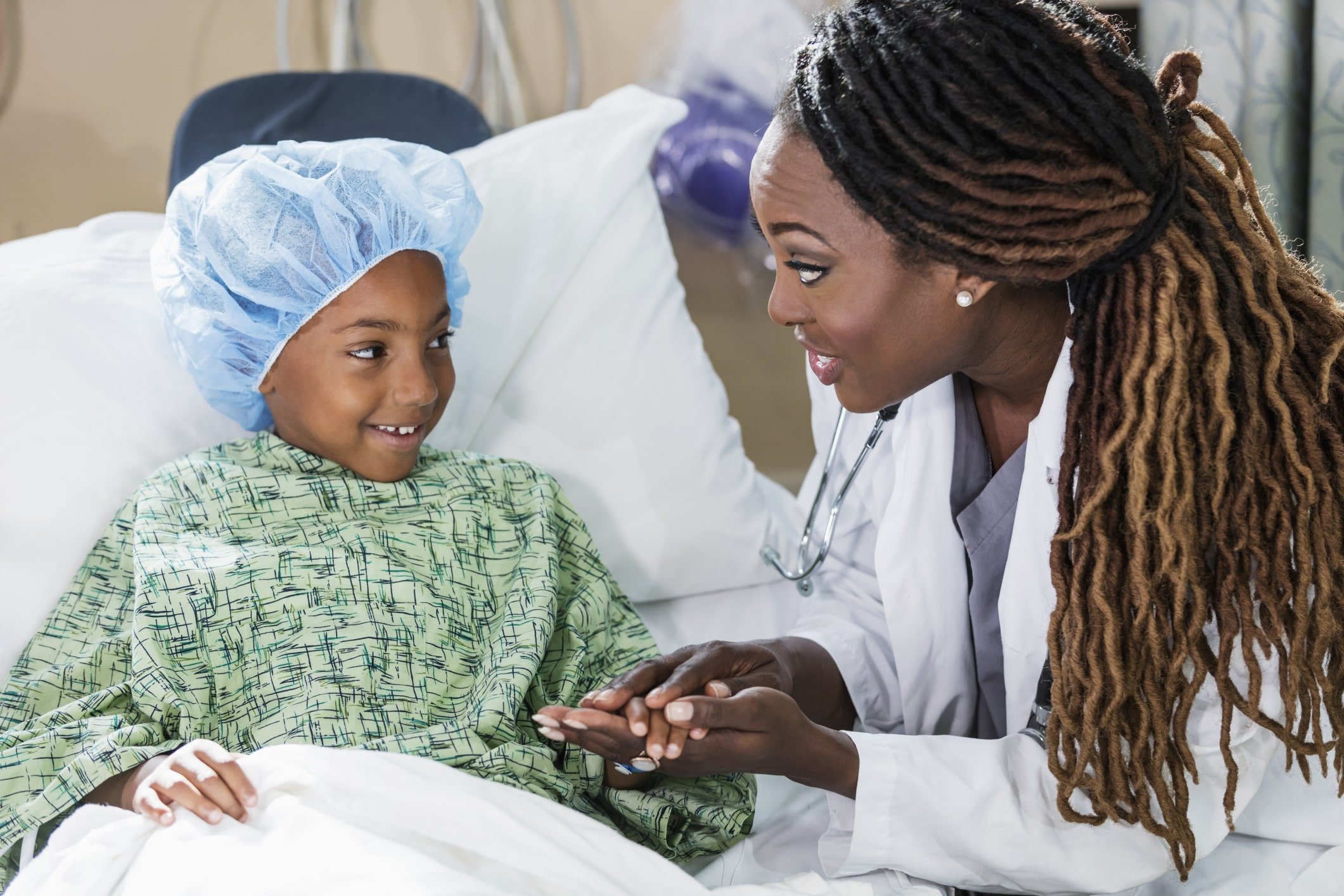 Nurse chatting with young child