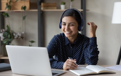A certified interpreter working at a computer  A certified interpreter working at a computer