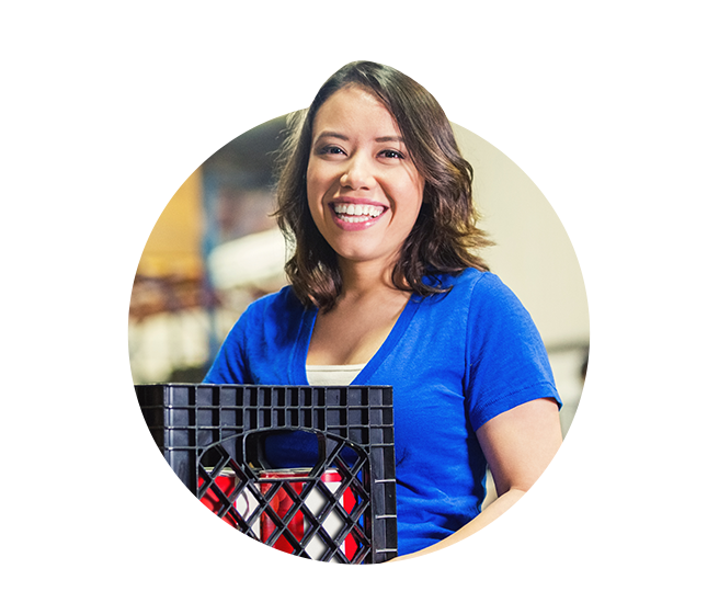 Woman holding crate with food