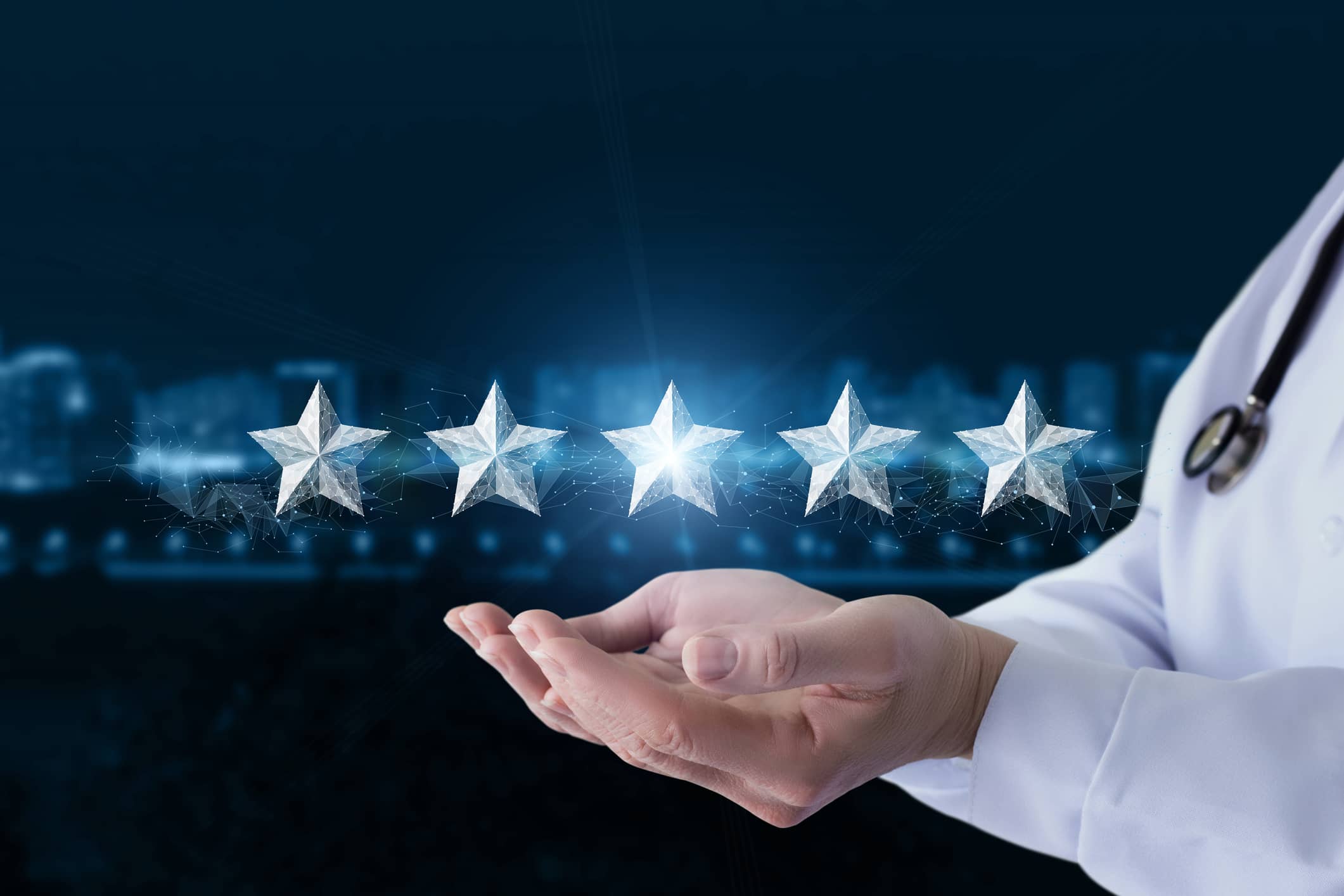 Doctor's hands with five stars floating above