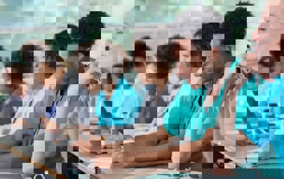 diverse group of med students in green and blue scrubs, happy and engaged diverse group of med students in green and blue scrubs, happy and engaged