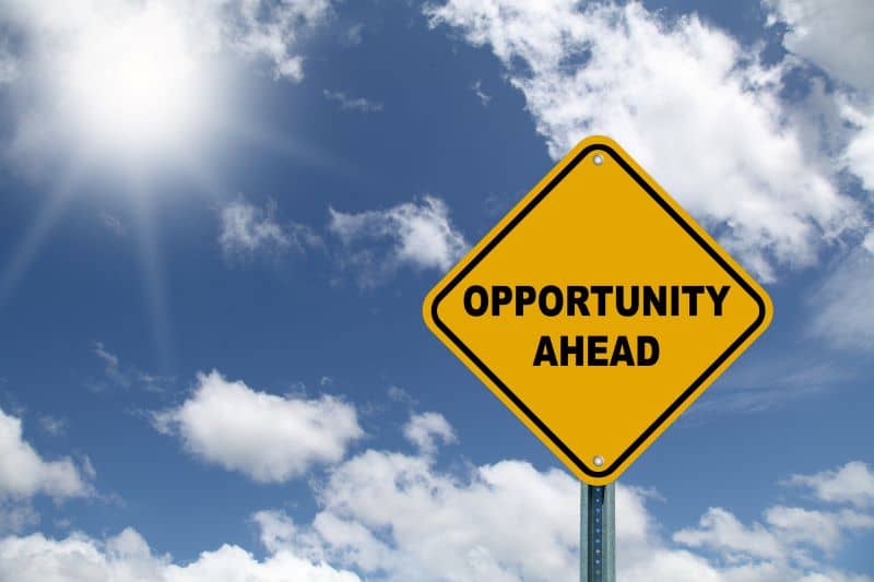 Yellow opportunity ahead road sign with sky Yellow opportunity ahead road sign with sky