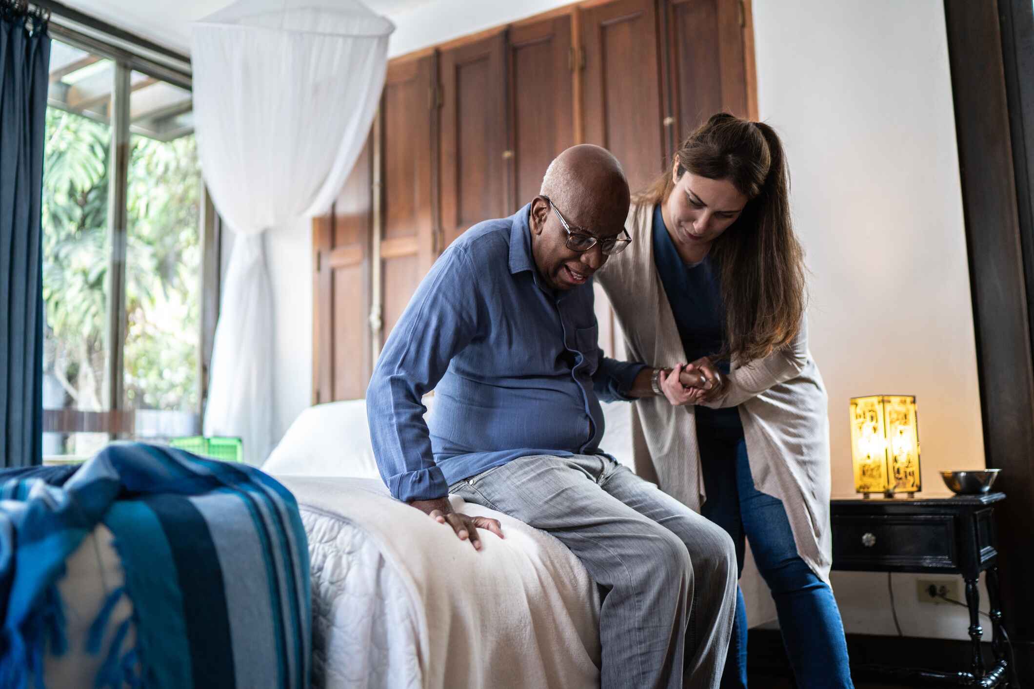 home health nurse helping a patient home health nurse helping a patient