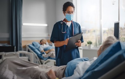 nurse looking at a patient nurse looking at a patient