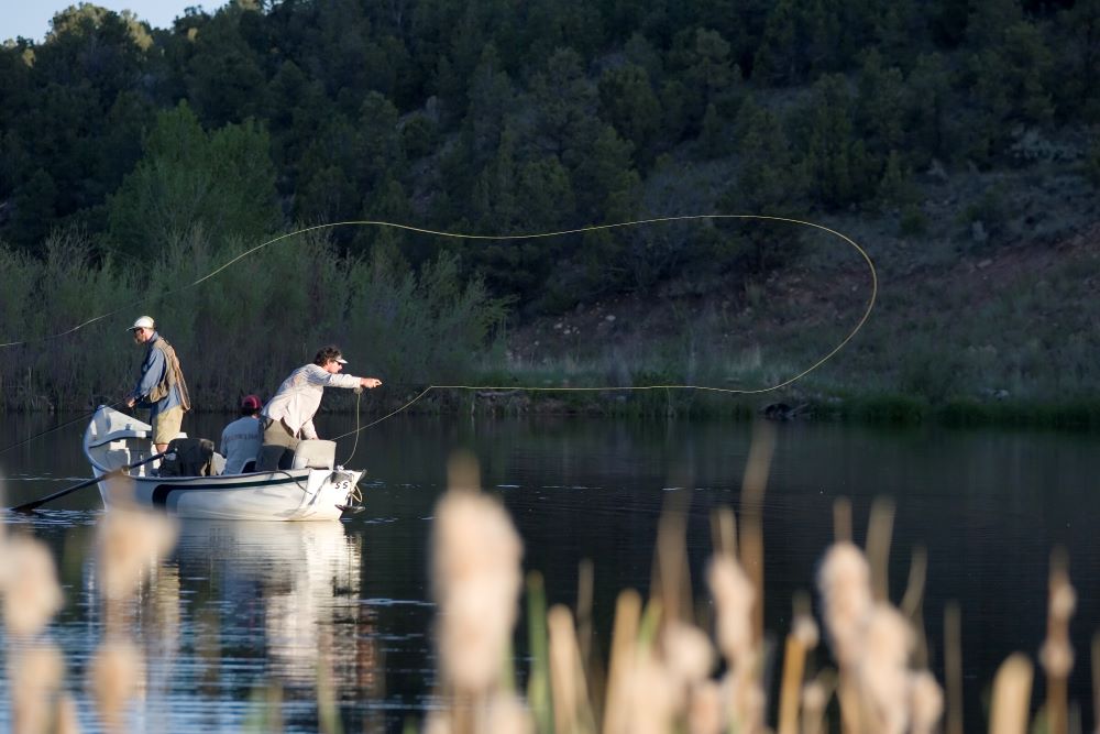 people in fishing boat fishing