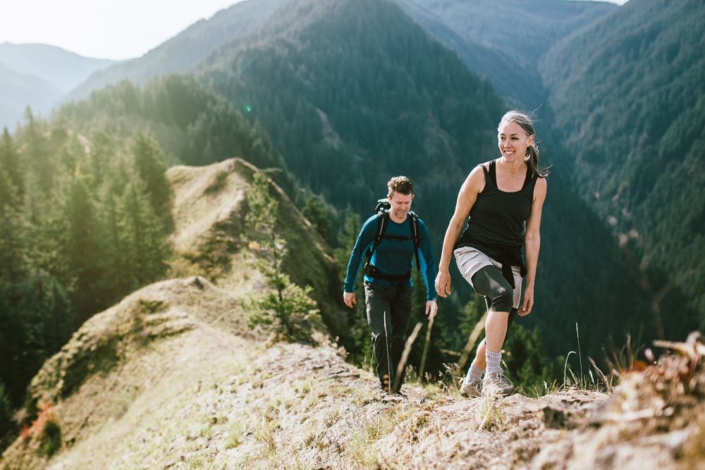 two people hiking in the mountains