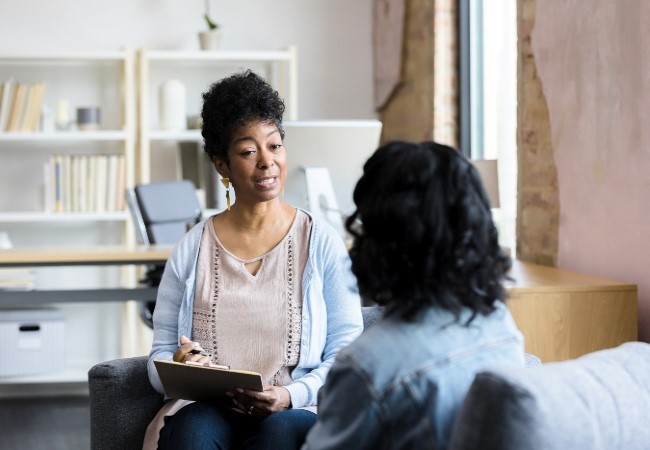 Psychiatrist working with patient in office Psychiatrist working with patient in office