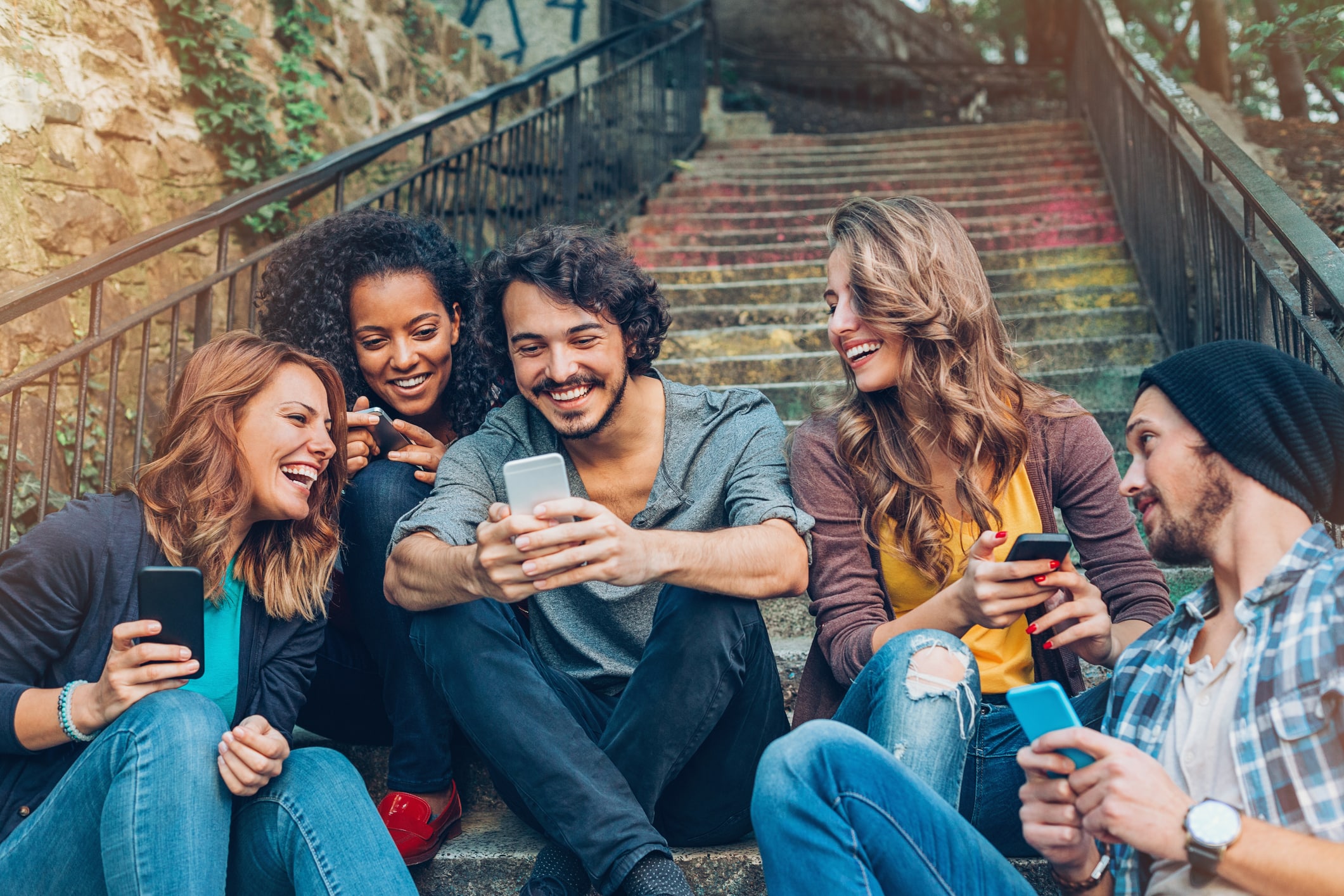 group of happy friends networking on phones group of happy friends networking on phones