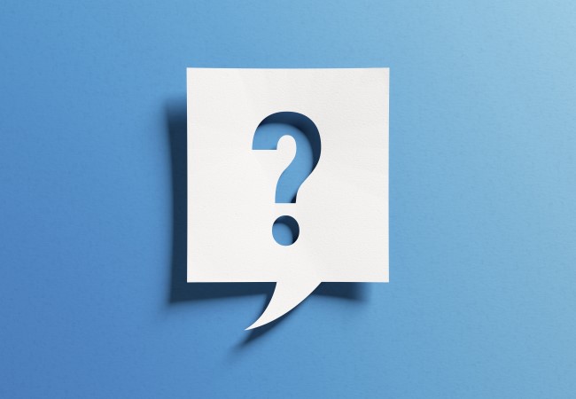 Question mark sitting on a blue background Question mark sitting on a blue background