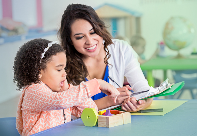 Therapist working with child