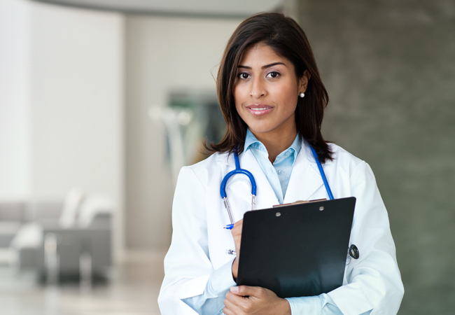 Female physician with clipboard Female physician with clipboard