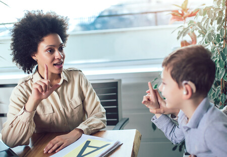 Female language interpreter working male child